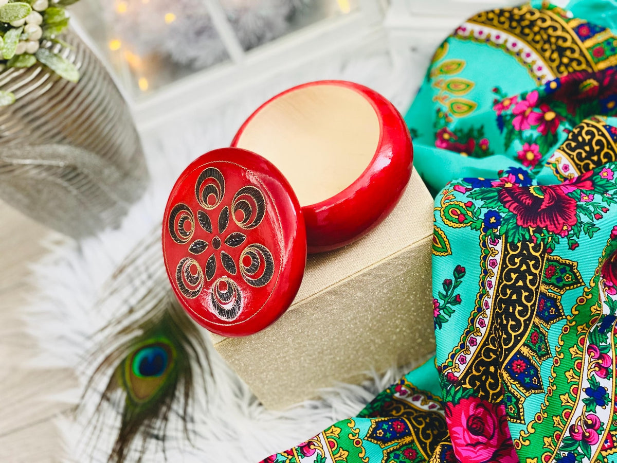 Red wooden box for jewelry and trinkets, round watch box with inlaid lid.