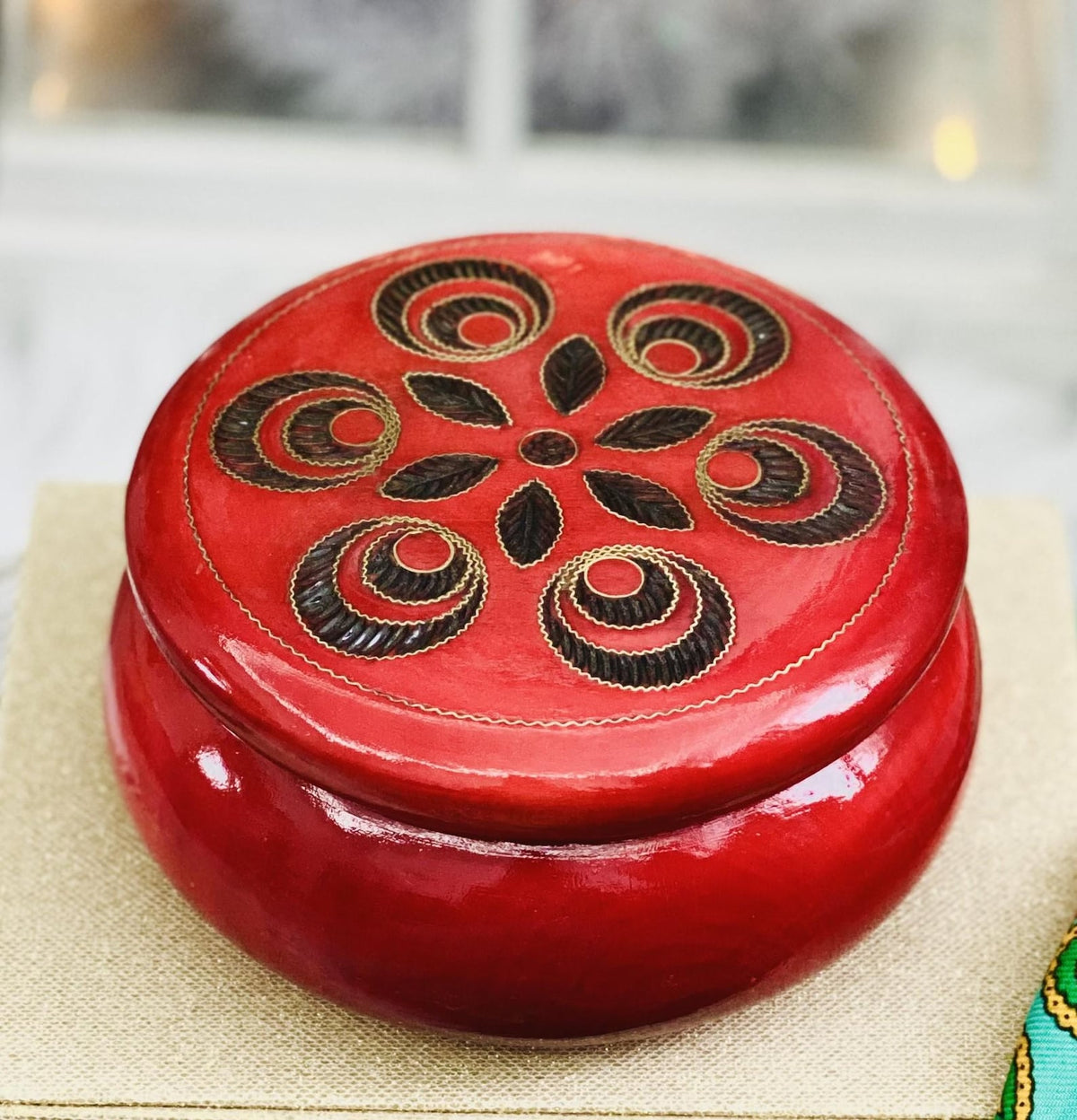 Red wooden box for jewelry and trinkets, round watch box with inlaid lid.