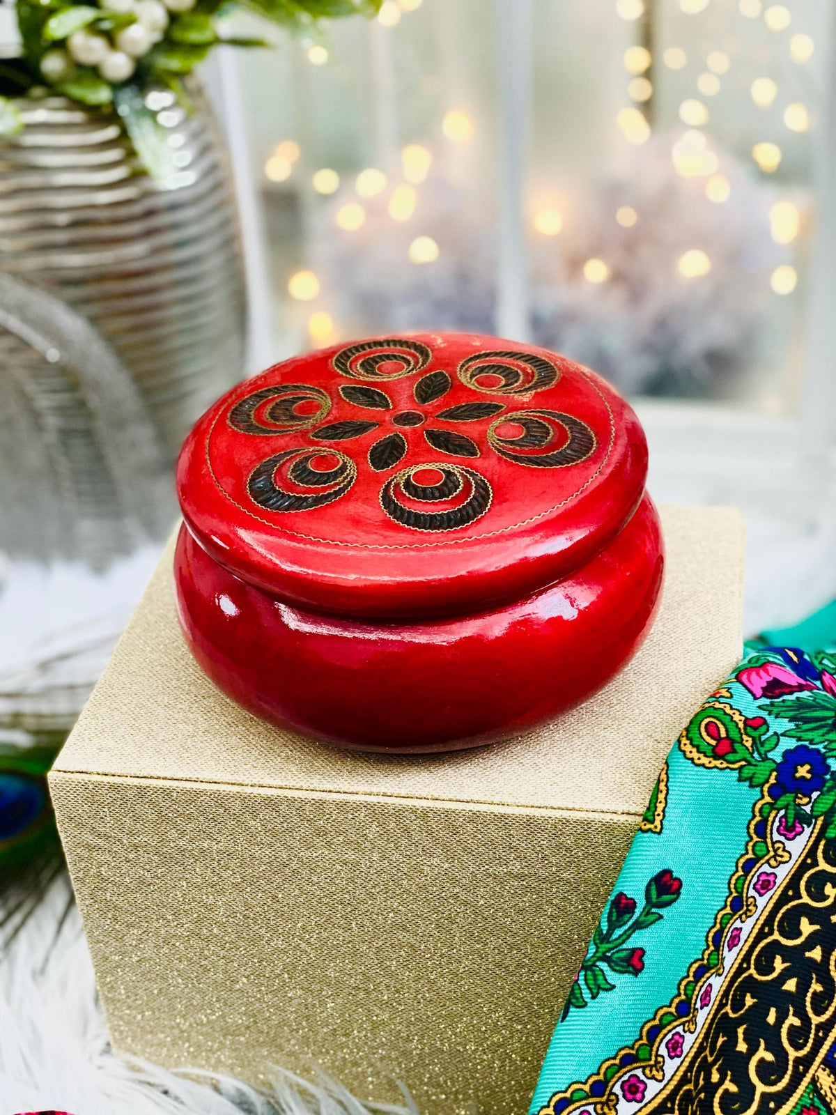 Red wooden box for jewelry and trinkets, round watch box with inlaid lid.